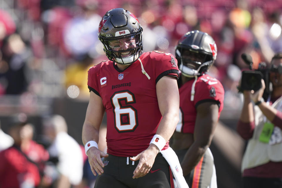 Tampa Bay Buccaneers quarterback Baker Mayfield (6) smiles after watching a teammate dance before an NFL football game against the New Orleans Saints, Sunday, Dec. 31, 2023, in Tampa, Fla. (AP Photo/Peter Joneleit)