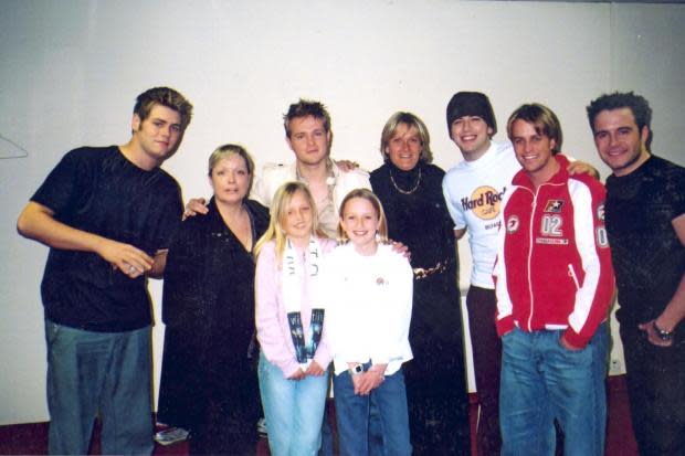 GREET: Carlisle friends Ellie Graham and Sarah Tod meet the band with mums Tina and Gillian