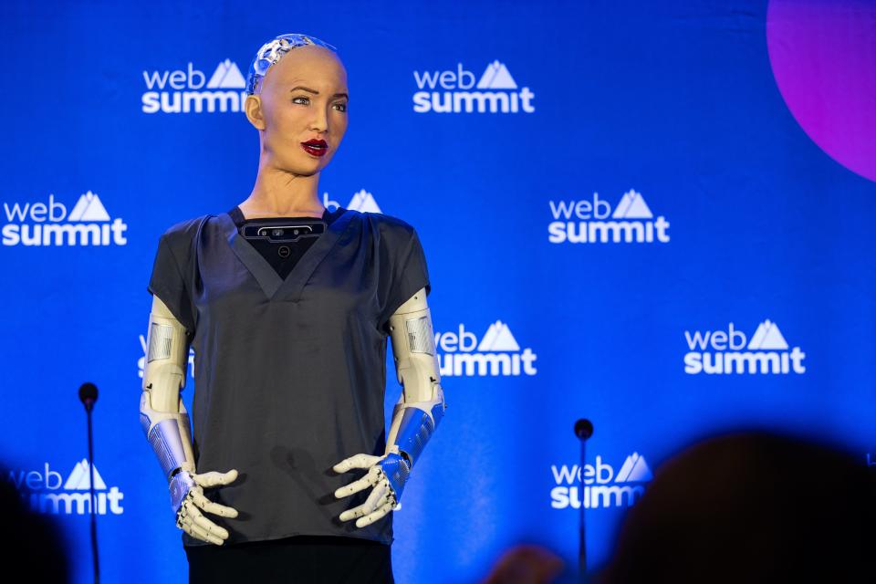 Hanson Robotics' Sophia giving a speech on stage at a Web Summit conference