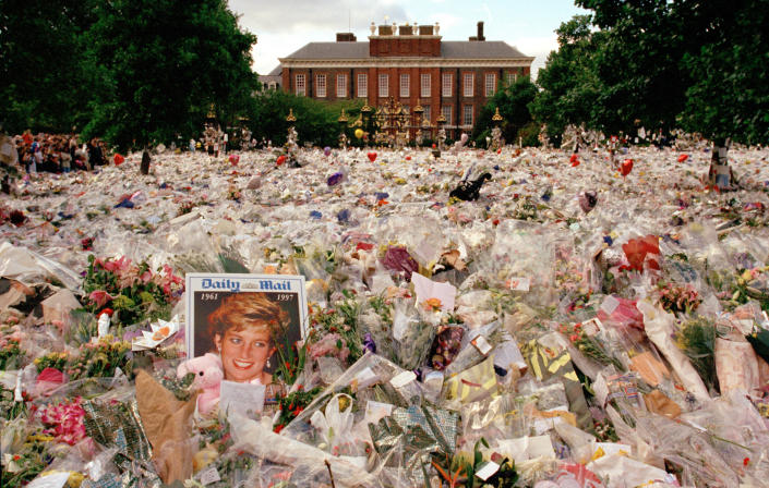 Flowers and mourners outside Kensington Palace in the days following the funeral of Princess Diana, in London, England, September 1997. (HBO Max / Alamy Stock Photo)