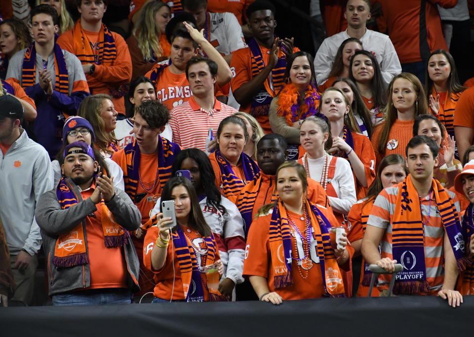 Clemson fans cheer before of the College Football Playoff National Championship game in New Orleans Monday, January 13, 2020.