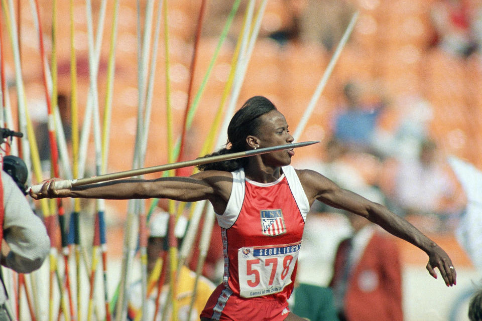 FILE - In this Sept. 24, 1988, file photo, Jackie Joyner-Kersee of East St. Louis, Ill., makes her javelin throw during heptathlon competition at the Seoul Olympics in South Korea. (AP Photo/Lennox McLendon, File)