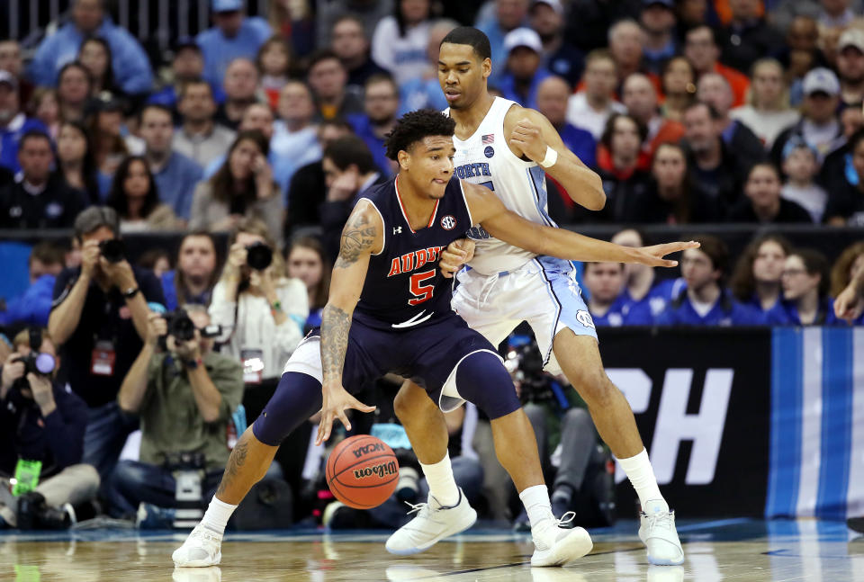 KANSAS CITY, MISSOURI - MARCH 29: Chuma Okeke #5 of the Auburn Tigers handles the ball against Garrison Brooks #15 of the North Carolina Tar Heels during the 2019 NCAA Basketball Tournament Midwest Regional at Sprint Center on March 29, 2019 in Kansas City, Missouri. (Photo by Christian Petersen/Getty Images)