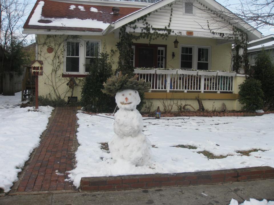 The author's former house in Nashville with snowman in front 
