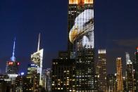 An image of an animal is projected onto the Empire State Building as part of an endangered species projection to raise awareness, in New York August 1, 2015. (REUTERS/Eduardo Munoz)