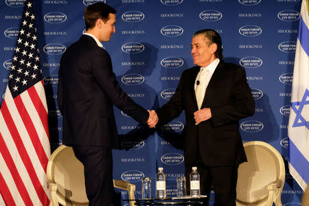 White House senior adviser Jared Kushner, shakes hands with Haim Saban, before discussing the Trump administration's approach to the Middle East region at the Saban Forum in Washington, U.S., December 3, 2017. REUTERS/James Lawler Duggan