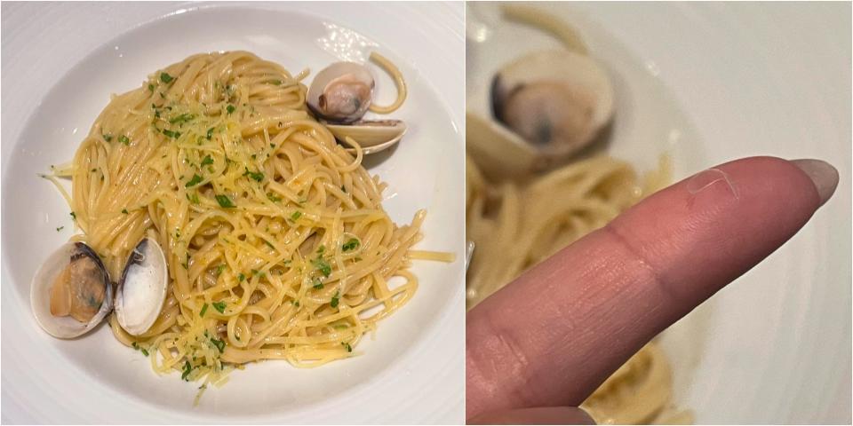 A composite image of a plate of linguine with clams and of the author's finger with a small bit of clear plastic on it on Carnival Firenze