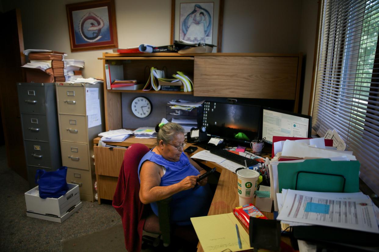 Juanita Scherich, ICWA supervisor for the Oglala Sioux Tribe, responds to emails in her office in Pine Ridge on Wednesday, Aug. 23, 2023. (Makenzie Huber / South Dakota Searchlight)