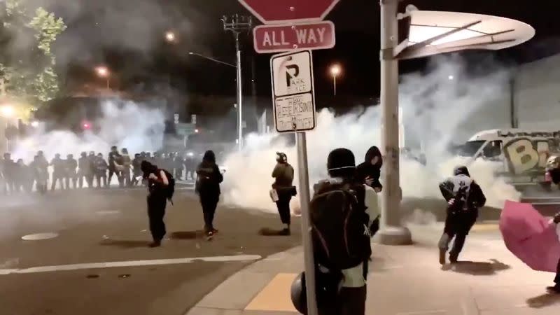 Protesters confront with the police near an Immigration and Customs Enforcement centre in Portland