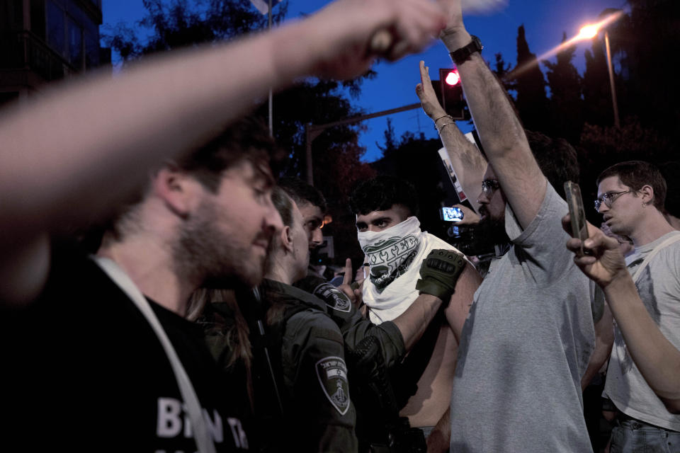 Police restrain a supporter of Israeli-American hostage Hersh Goldberg-Polin, who was kidnapped on Oct. 7, 2023, during a protest outside of Israeli Prime Minister Benjamin Netanyahu's residence to demand a deal for the immediate release of all hostages, after Hamas released a video of Goldberg-Polin, in Jerusalem, Wednesday, April 24, 2024. (AP Photo/Maya Alleruzzo)