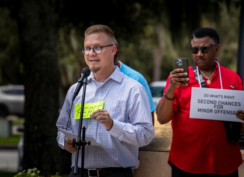 Rev. Ben Turner of Strong Tower Church in Lakeland shares an anecdote of someone arrested for a non-violent misdemeanor during Tuesday's gathering of members of the Polk Ecumenical Action Council for Empowerment (PEACE) at Fort Blount Park In Bartow.