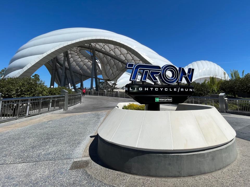 tron sign and roller coaster at magic kingdom in disney world