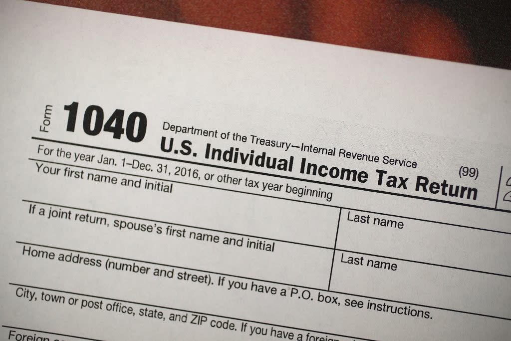 A copy of a IRS 1040 tax form is seen at an H&R Block office on the day President Donald Trump signed the Republican tax cut bill in Washington, DC on December 22, 2017 in Miami, Florida. (Photo by Joe Raedle/Getty Images)