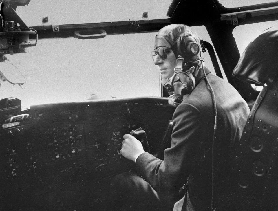 FILE - In this April 11, 1956 file photo the Duke of Edinburgh controls a Blackburn military transport plane a few minutes before a fire extinguisher burst and filled the cockpit with choking fumes. Buckingham Palace says Prince Philip, husband of Queen Elizabeth II, has died aged 99. (AP Photo/File)