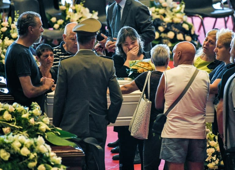 Relatives mourning in Genoa last month near the coffins of some of the victims of the collapsed bridge