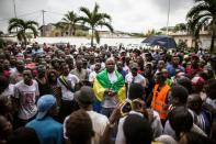 Supporters of the Gabonese opposition leader Jean Ping gather outside his party headquarters in Libreville on August 28, 2016