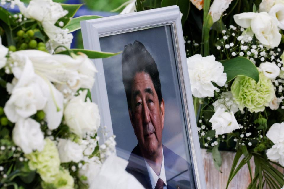 A picture of late former Japanese prime minister Shinzo Abe, who was shot while campaigning for a parliamentary election, is seen at Headquarters of the Japanese Liberal Democratic Party in Tokyo (REUTERS)