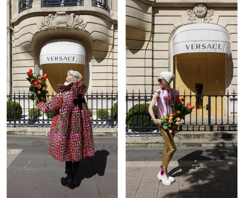 Wearing Christian Lacroix and Balenciaga by Nicolas Ghesquière in front of the Versace store.