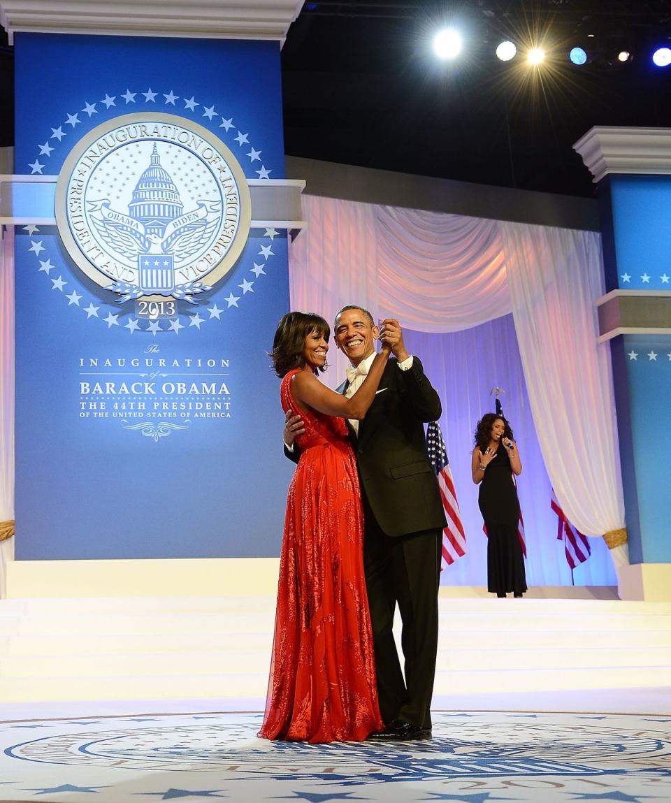 <p>The Obamas celebrate another Presidential term in the White House with a dance at Barack's second inaugural ball. The First Lady, again wearing Jason Wu, looked sensational in a chiffon and velvet red evening gown. </p>