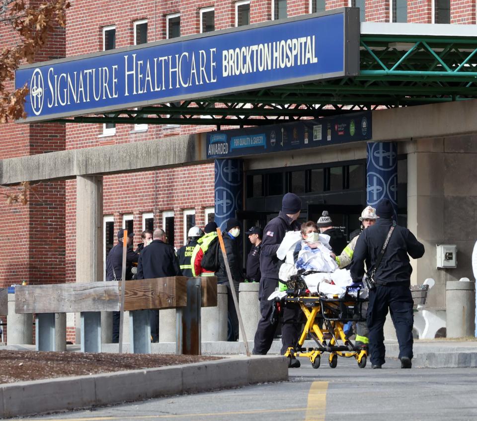 Patients are evacuated at Signature Healthcare Brockton Hospital after a transformer fire broke out in the basement of a building on the campus on Tuesday, Feb. 7, 2023.