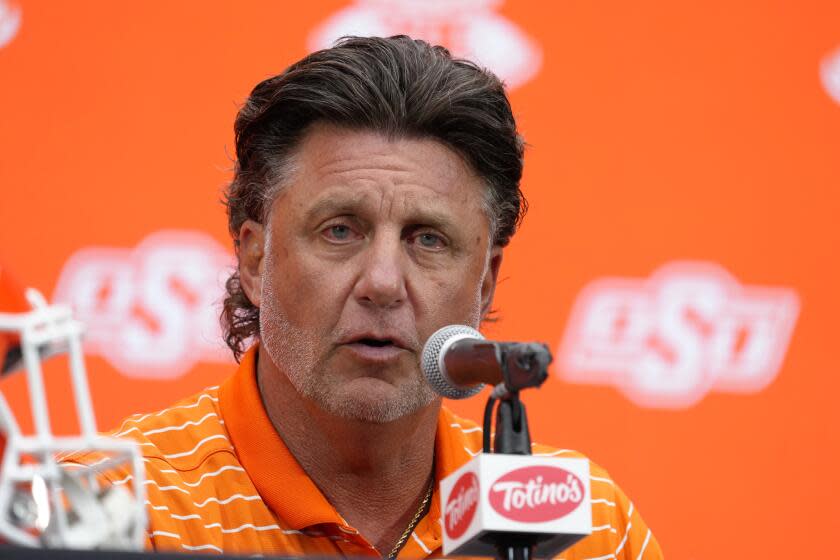 Oklahoma State head coach Mike Gundy speaks during the Big 12 NCAA college football media days in Las Vegas