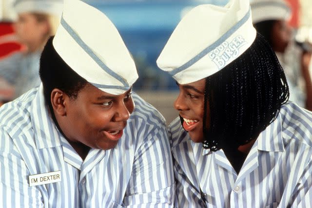 <p>Paramount/Getty</p> (L-R) Kenan Thompson and Kel Mitchell are pictured smiling in a scene from the 1997 film 'Good Burger'.