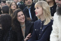Singer Angele, right, and actress Anna Mouglalis attend Chanel fashion collection during Women's fashion week Fall/Winter 2020/21 presented Tuesday, March 3, 2020 in Paris. (AP Photo/Thibault Camus)