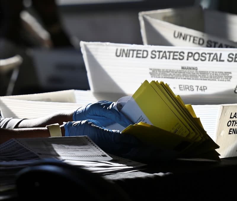 Employees of the Fulton County Board of Registration and Elections process ballots in Atlanta