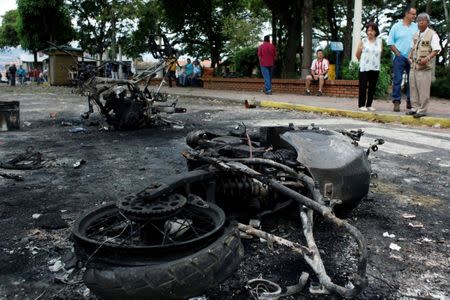 Burnt police motorcycles are seen during a protest against Venezuela's President Nicolas Maduro's government in Palmira, Venezuela May 16, 2017. REUTERS/Carlos Eduardo Ramirez