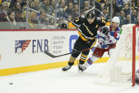 New York Rangers' Zac Jones (6) tries to keep Pittsburgh Penguins' Evgeni Malkin (71) from the puck during the second period of an NHL hockey game, Saturday, Feb. 26, 2022, in Pittsburgh. (AP Photo/Keith Srakocic)