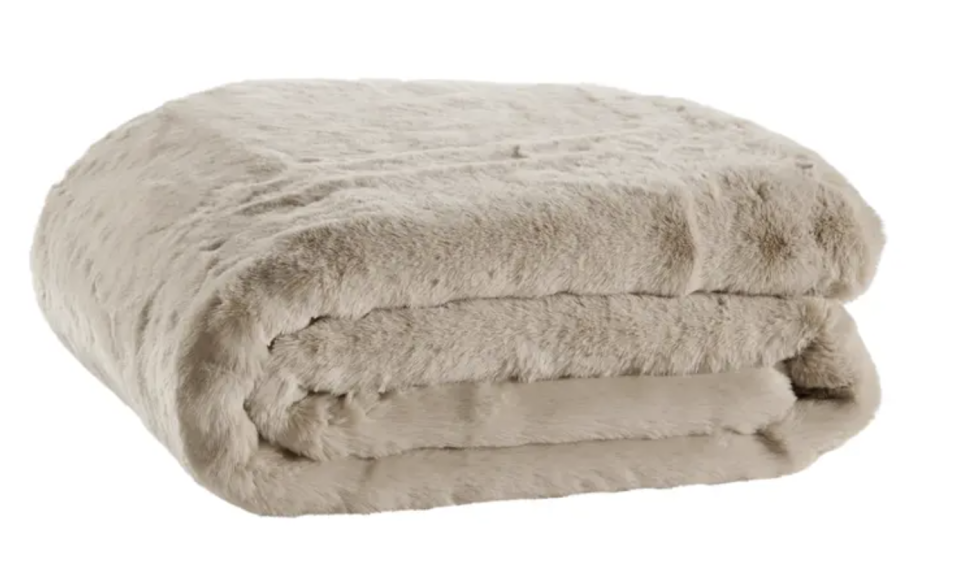 A folded grey Matt Blatt Delmar Faux Fur Throw against a white background.