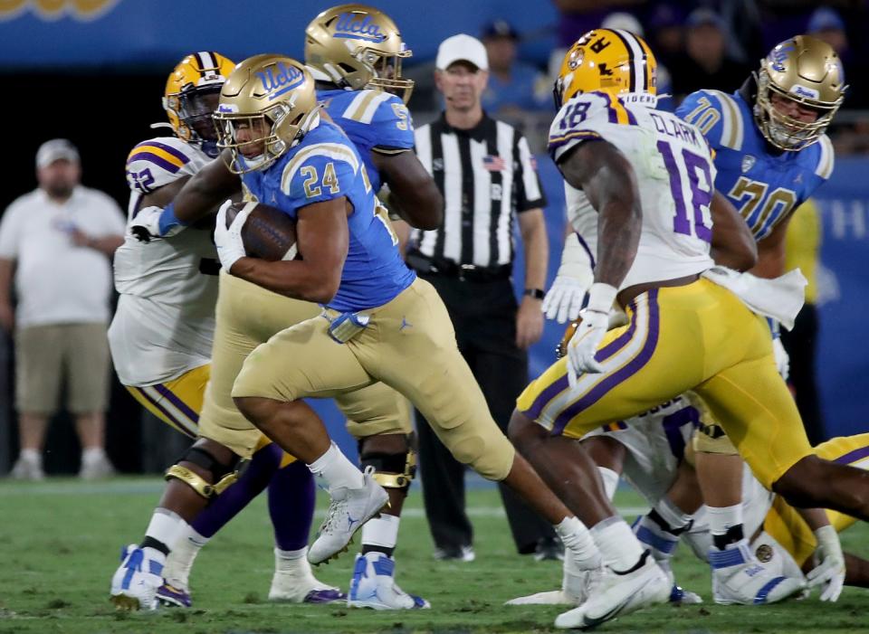 UCLA running back Zach Charbonnet breaks free for a long gain against LSU in the third quarter Sept. 4, 2021.