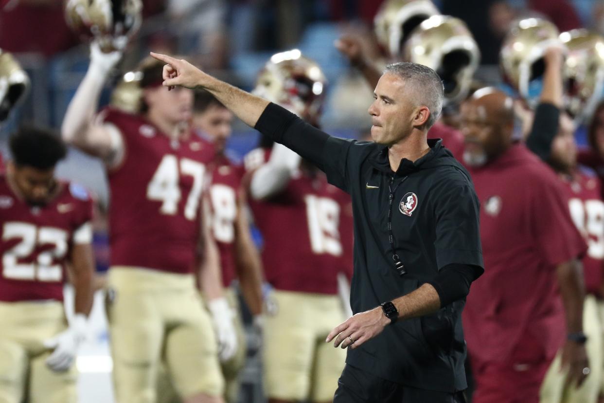 CHARLOTTE, NORTH CAROLINA - DECEMBER 2: Head coach Mike Norvell of the Florida State Seminoles points during pregame before taking on the Louisville Cardinals in the ACC Championship at Bank of America Stadium on December 2, 2023 in Charlotte, North Carolina. (Photo by Isaiah Vazquez/Getty Images)