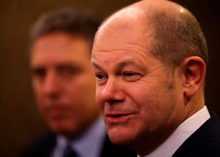 Germany's Finance Minister Olaf Scholz attends a news conference next to Argentina's Treasury Minister Nicolas Dujovne during the 2018 G20 Conference entitled "The G20 Agenda Under the Argentine Presidency", in Buenos Aires, Argentina, March 18, 2018. REUTERS/Agustin Marcarian