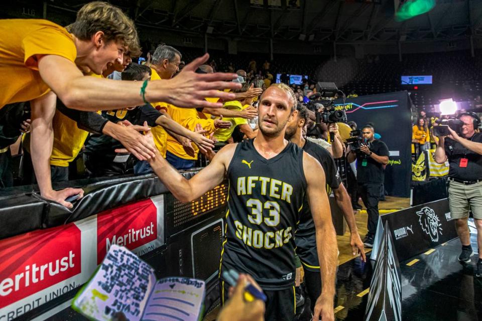 The AfterShocks Conner Frankamp gets congratulated by the fans after beating the Gutter Cat Gang at Koch Arena Wednesday during the TBT Tournament.