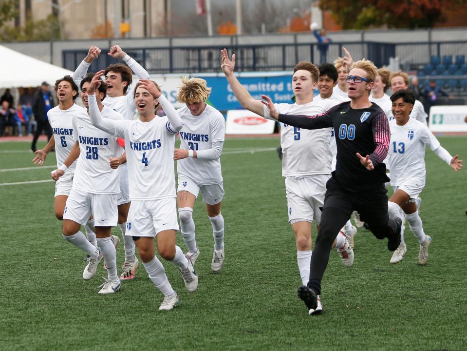 The Mishawaka Marian team runs toward its fans in celebration after winning the IHSAA Class 2A boys soccer state championship game against Evansville Memorial Saturday, Oct. 28, 2023, at Carroll Stadium in Indianapolis.