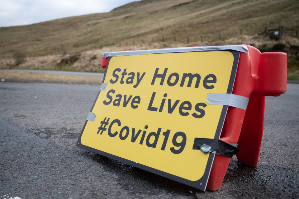 BRECON, UNITED KINGDOM - APRIL 04: A sign on the A470 encouraging people to stay home on April 04, 2020 in Brecon, United Kingdom. The Coronavirus (COVID-19) pandemic has spread to many countries across the world, claiming over 70,000 lives and infecting over 1 million people. (Photo by Matthew Horwood/Getty Images)