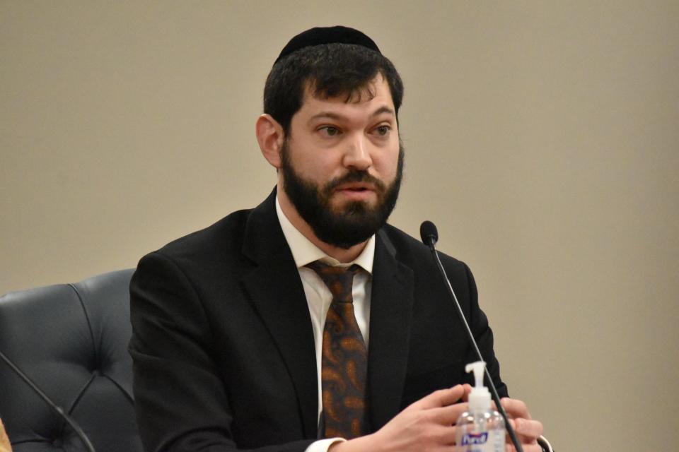 South Bend Redevelopment Commission member Eli Wax explains why he cast the lone dissenting vote on the commission's decision to purchase a parcel of land with plans for it to host a low-barrier homeless shelter during a meeting on Thursday, Feb. 8, 2024.