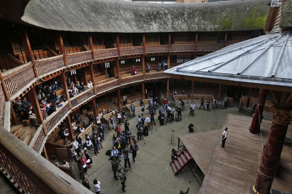 An actor performs a scene from William Shakespeare's Hamlet for members of the media and a small audience during a photo call to present Hamlet at Shakespeare’s Globe theatre, London, Wednesday, April 23, 2014. Four centuries after his death, William Shakespeare is probably Britain's best-known export, his words and characters famous around the world. Shakespeare's Globe theater is setting out to test the Bard's maxim that "all the world's a stage" by taking "Hamlet" to every country on Earth world, more than 200 in all. (AP Photo/Lefteris Pitarakis)