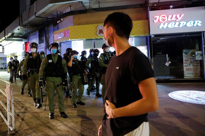 Protest to mark the first anniversary of an attack in a train station by an armed crowd wearing white shirts, demanding justice for the victims of violence and broader freedoms, at a shopping mall in Hong Kong's Yuen Long