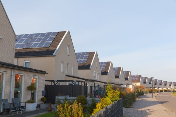 Row of homes, all with solar on their roofs.