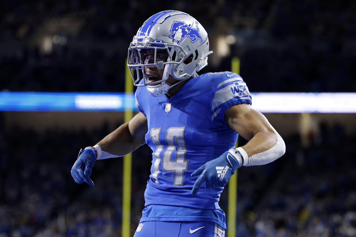 DETROIT, MICHIGAN - DECEMBER 04: Amon-Ra St. Brown #14 of the Detroit Lions celebrates after a touchdown in the first quarter of the game against the Jacksonville Jaguars at Ford Field on December 04, 2022 in Detroit, Michigan. (Photo by Leon Halip/Getty Images)