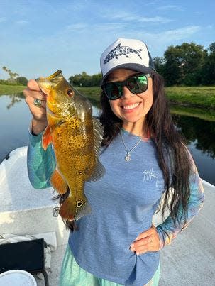 Captain Virginia Salvador caught and released this beautiful peacock bass while fishing Lake Worth in Florida with Bill Lepree of South Florida Bass Charters.