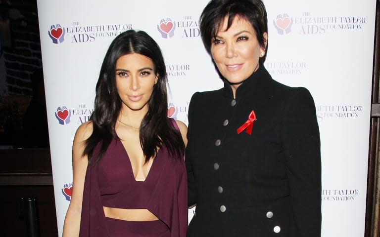 Kim Kardashian Raises Toast For Elizabeth Taylor Foundation/World AIDS Day At The Abbey