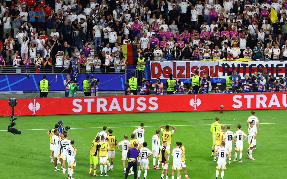 The German players celebrate in front of their fans