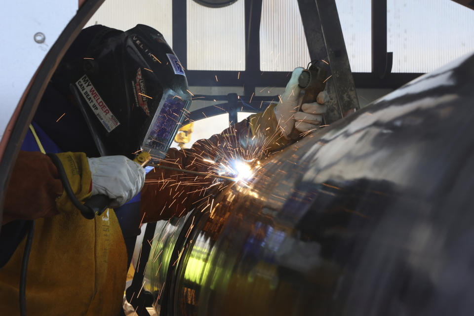 A worker is seen welding on the construction of the intersystem gas connection Bulgaria-Serbia in the village of Golyanovtsi, in Bulgaria, Wednesday, Feb.1, 2023. The presidents of Bulgaria and Serbia on Wednesday launched the construction of the Bulgarian part of a gas link that is designed to diversify the energy supplies of a region that until recently was almost fully dependent on natural gas deliveries from Russia. (AP Photo/Valentina Petrova)