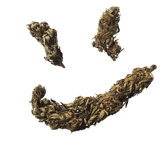 Marijuana buds forming a smiley face.