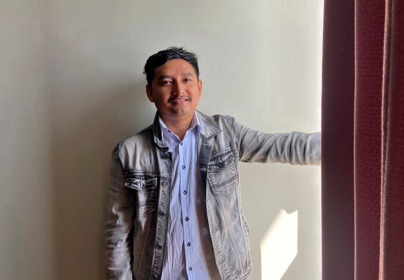 Kaung Thu Win poses for a photograph after his interview with Reuters at an undisclosed location