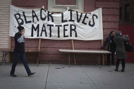 People attend a Martin Luther King day rally in the Harlem section of New York January 19, 2015. REUTERS/Carlo Allegri