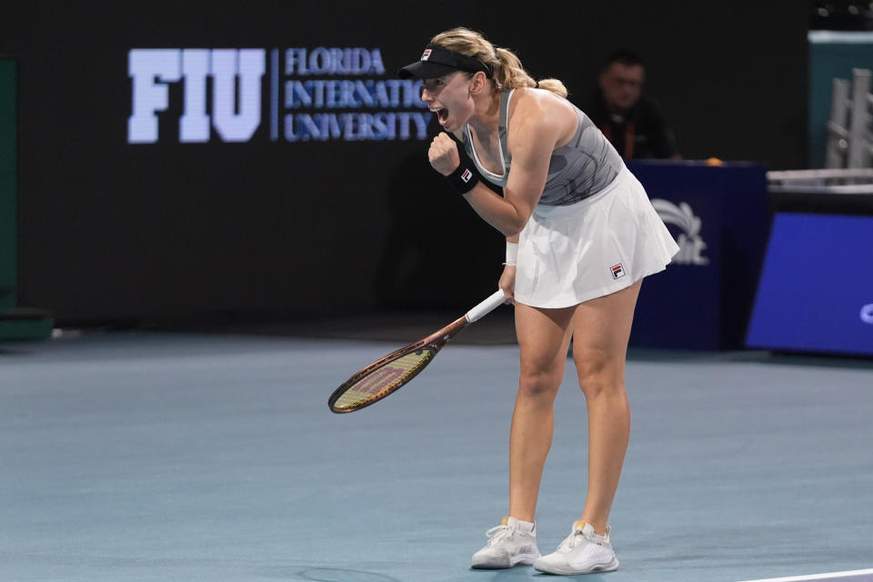 Ekaterina Alexandrova, of Russia, celebrates after beating Iga Swiatek, of Poland, during the Miami Open tennis tournament, Monday, March 25, 2024, in Miami Gardens, Fla. (AP Photo/Wilfredo Lee)